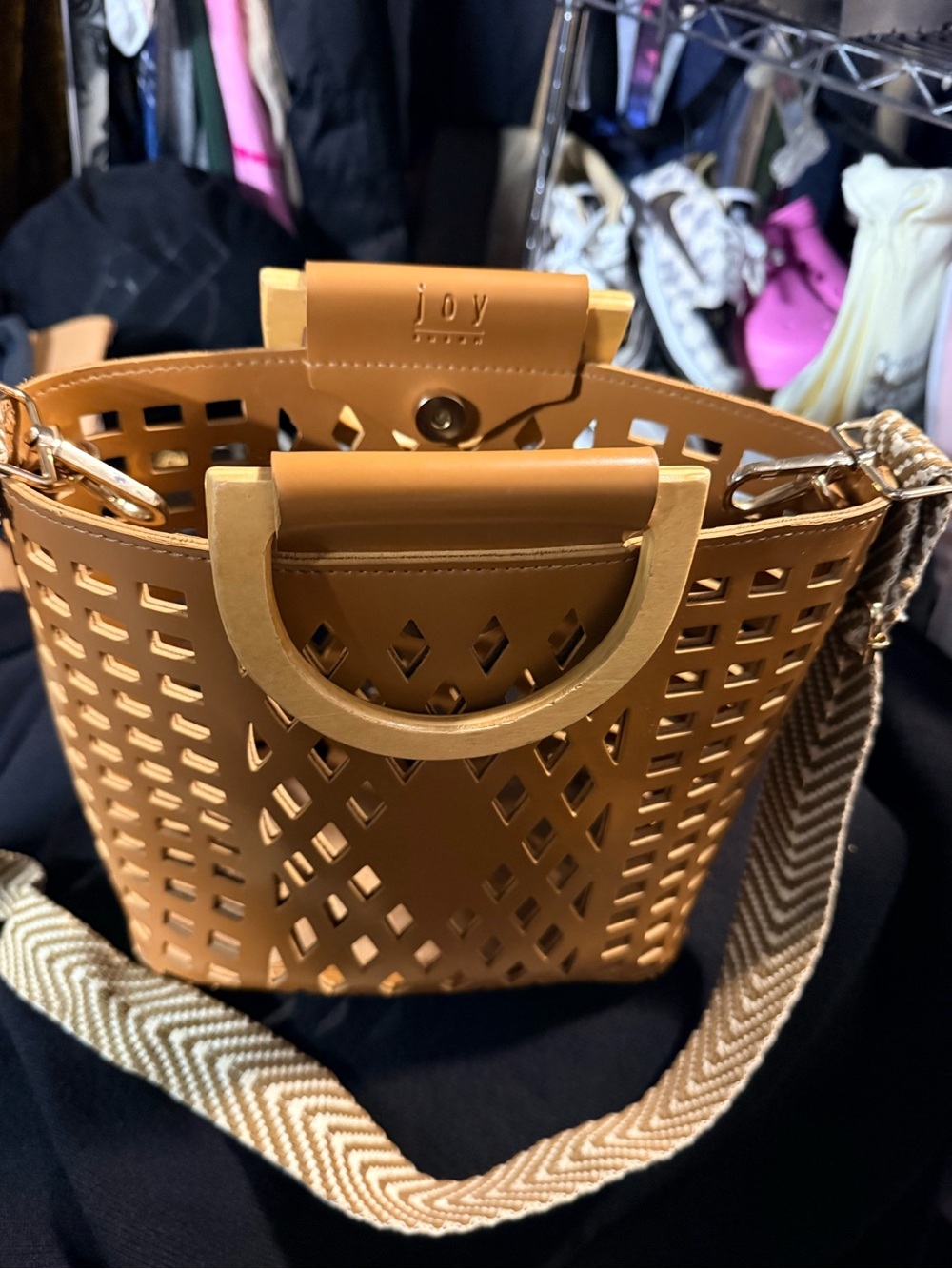 Joy Susan Tan Laser-Cut Bucket Bag with Gold Handles and Woven Strap